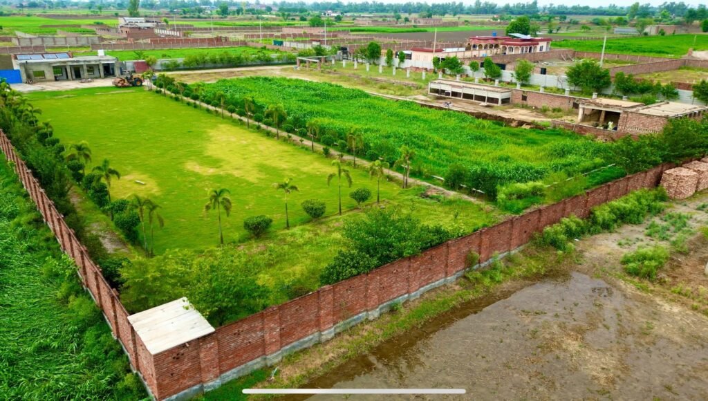 Aerial view of Lahore Orchard farm houses with lush green lawns